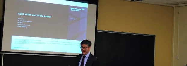 David Woo presenting to a room of students